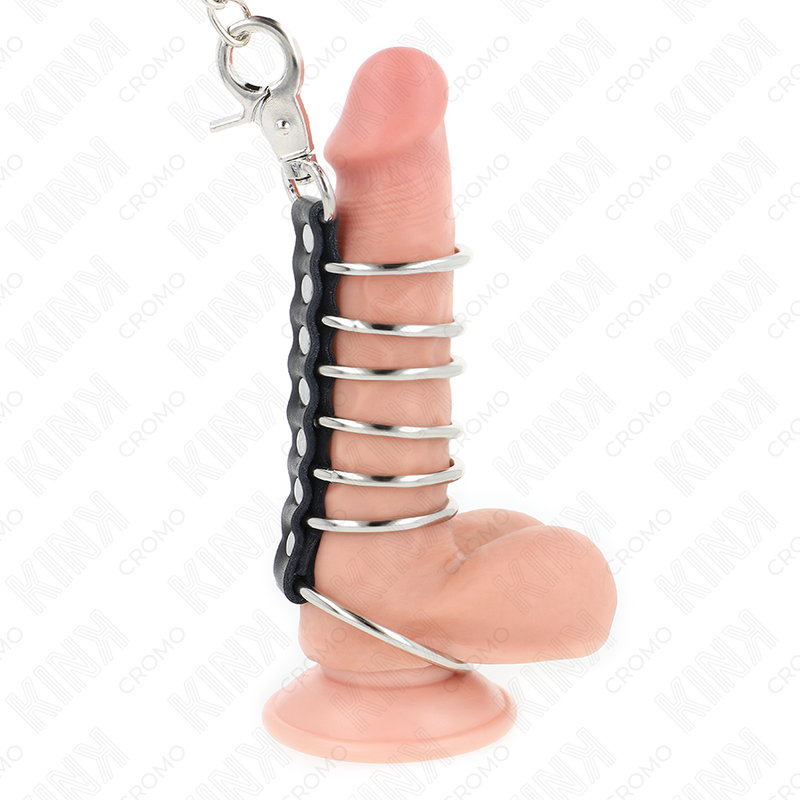 KINK – 7 ANILLOS PENE METAL 3.8 CM A 5 CM CONECTADOS CON POLIPIEL Y CADENA METAL 100 CM